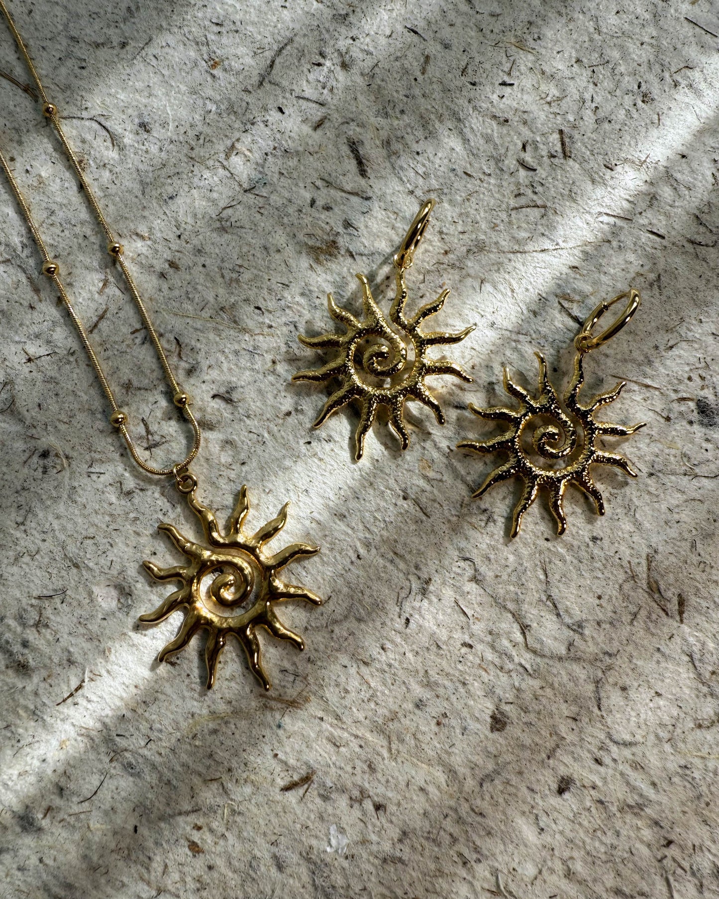 Textured gold sun pendant and earrings – Solar Spiral Set by Refla
