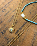 Mediterranean Spirit Duo – turquoise pearl necklace and evil eye blue bead necklace by Refla