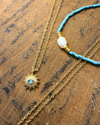 Mediterranean Spirit Duo – turquoise pearl necklace and evil eye blue bead necklace by Refla