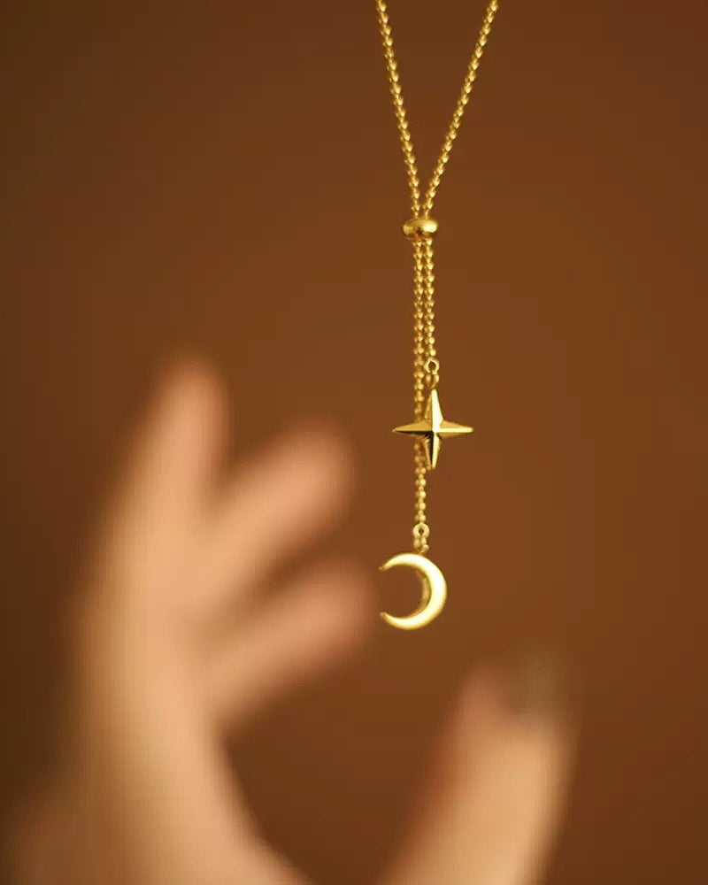 Gold star and moon lariat necklace