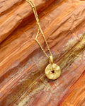 Close-up of mystical gold necklace