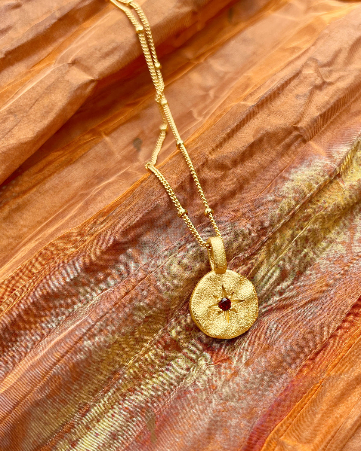 Close-up of mystical gold necklace