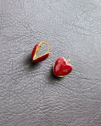 Playful heart-shaped gold hoop detail