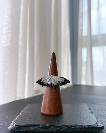 Detail of black and white moth wings jewelry