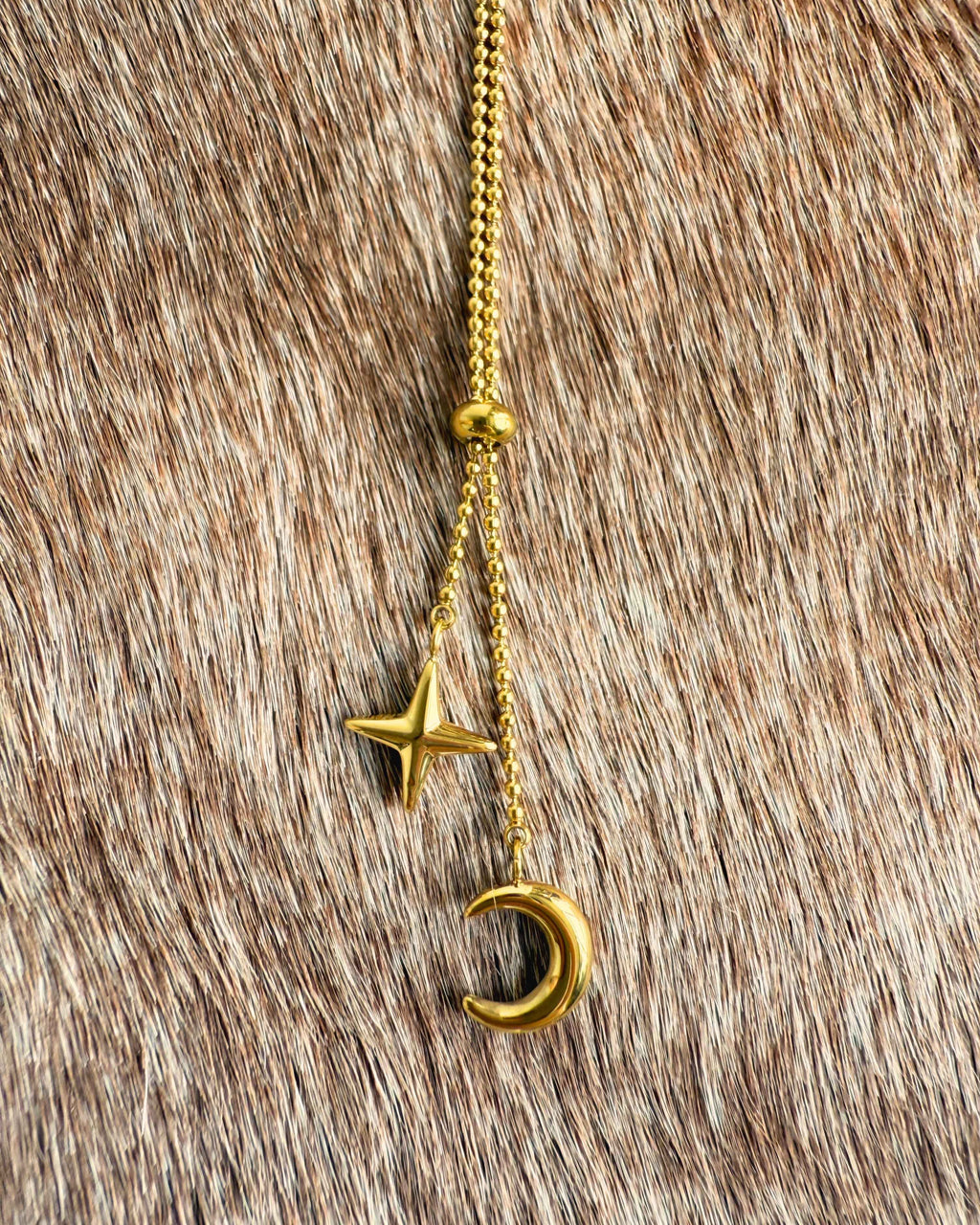 Delicate gold celestial necklace with crescent moon charm
