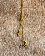 Delicate gold celestial necklace with crescent moon charm